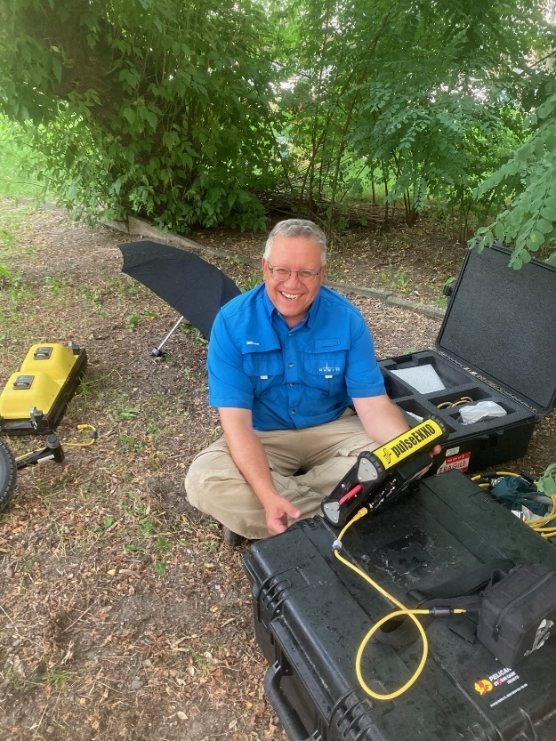 Professor Harry Jol preparing ground-penetrating radar equipment for field data collection.
