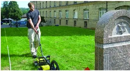 Researcher collecting ground-penetrating radar data at the HKP 562 forced-labor camp site in Vilnius.
