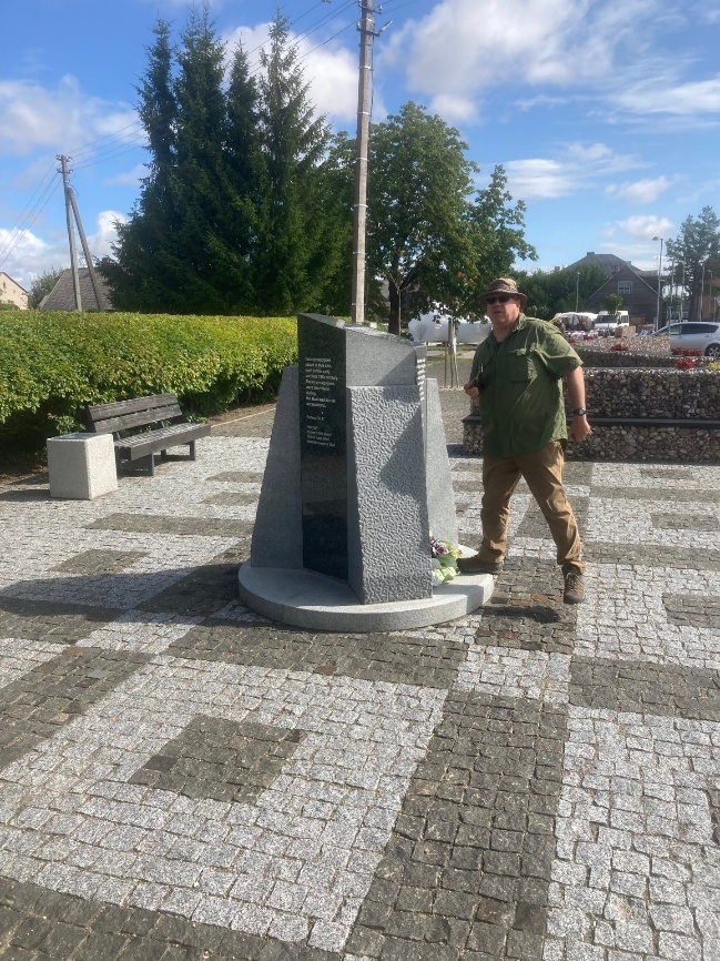 Professor Harry Jol standing beside the monument marking the former synagogue location in Šeduva.