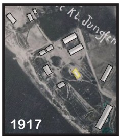 Annotated 1917 aerial photograph of the farm that preceded Jungfernhof, with former buildings outlined and a GPR-discovered building area highlighted in yellow.