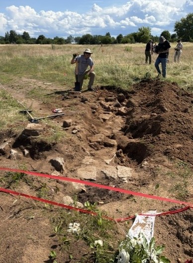 Excavated remains of the Jungfernhof prisoner barracks foundation after the first day of excavation in 2026.