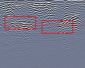 Corresponding Grid 8 ground-penetrating radar cross-section with two boxed reflection patterns interpreted as burial trenches.